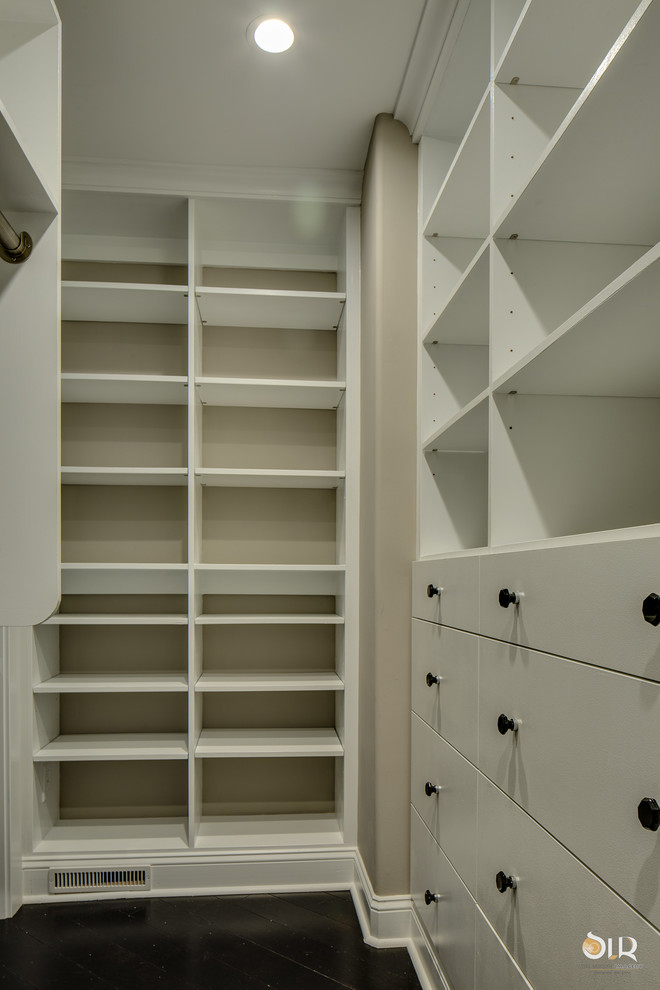 Walk-in closet - transitional gender-neutral dark wood floor and brown floor walk-in closet idea with open cabinets and white cabinets