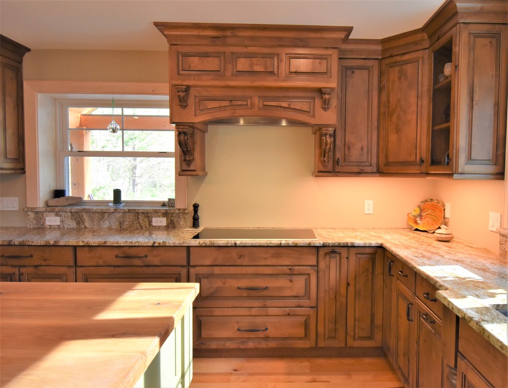 Kitchen - huge rustic kitchen idea with distressed cabinets