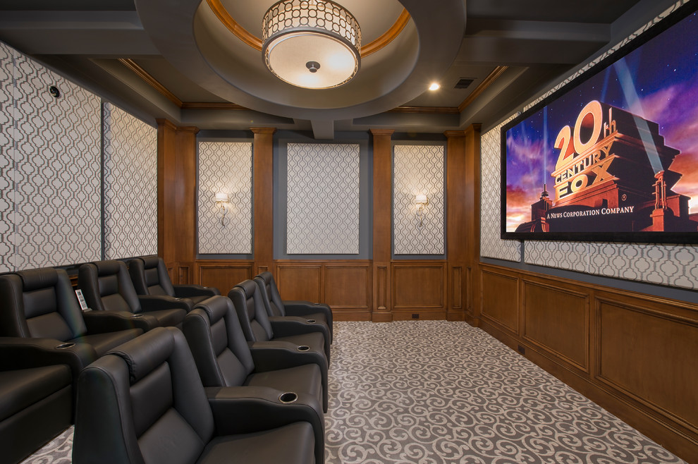 Design ideas for a mediterranean enclosed home theatre in Houston with carpet, a wall-mounted tv and multi-coloured floor.