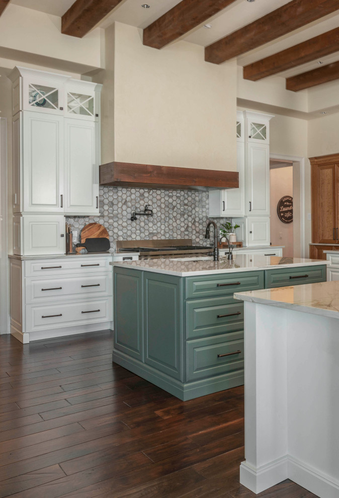 Eclectic open plan kitchen in Orlando with a farmhouse sink, recessed-panel cabinets, white cabinets, quartzite benchtops, grey splashback, mosaic tile splashback, panelled appliances, medium hardwood floors, with island, brown floor, white benchtop and exposed beam.