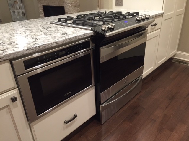 Example of a transitional kitchen design in Omaha