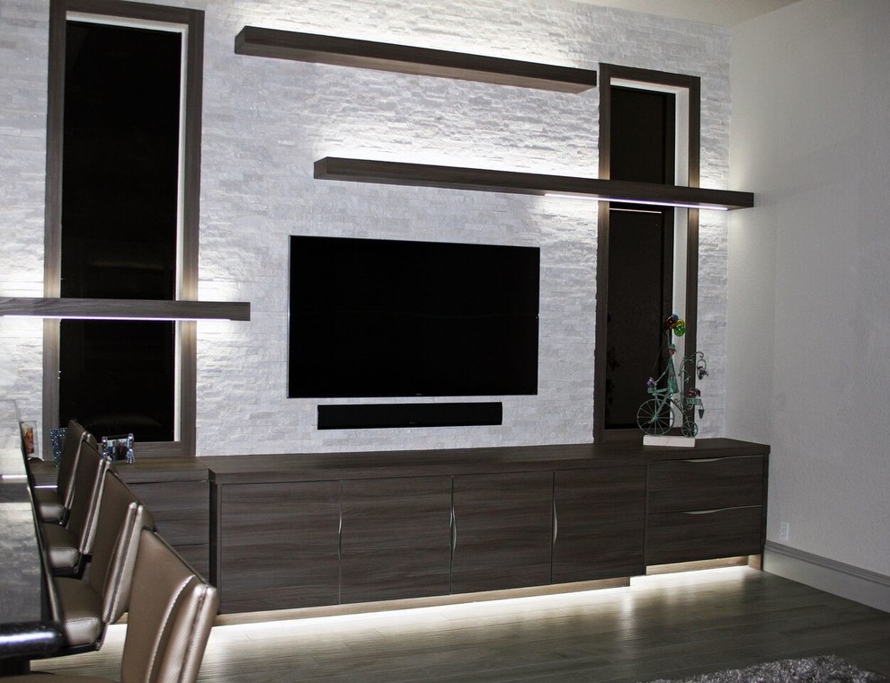 Family room - mid-sized contemporary open concept porcelain tile and gray floor family room idea in Miami with gray walls and a wall-mounted tv