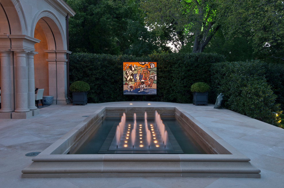 Inspiration for a transitional patio in Dallas with a water feature.