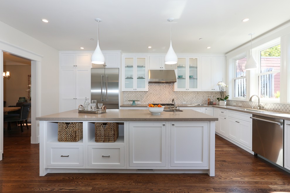 Design ideas for a contemporary l-shaped kitchen in San Francisco with shaker cabinets, white cabinets, quartz benchtops, white splashback, stainless steel appliances and brown benchtop.