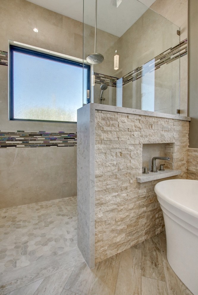 Inspiration for a mid-sized contemporary master bathroom in Phoenix with shaker cabinets, beige cabinets, a freestanding tub, a curbless shower, a two-piece toilet, beige tile, porcelain tile, beige walls, porcelain floors, an undermount sink, engineered quartz benchtops, beige floor, an open shower and grey benchtops.