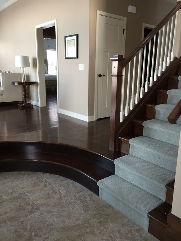 Inspiration for a mid-sized transitional ceramic tile foyer remodel with beige walls