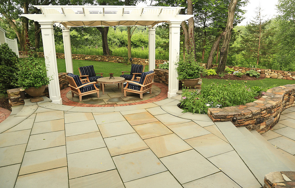 Photo of a large asian backyard patio in Bridgeport with a gazebo/cabana and natural stone pavers.