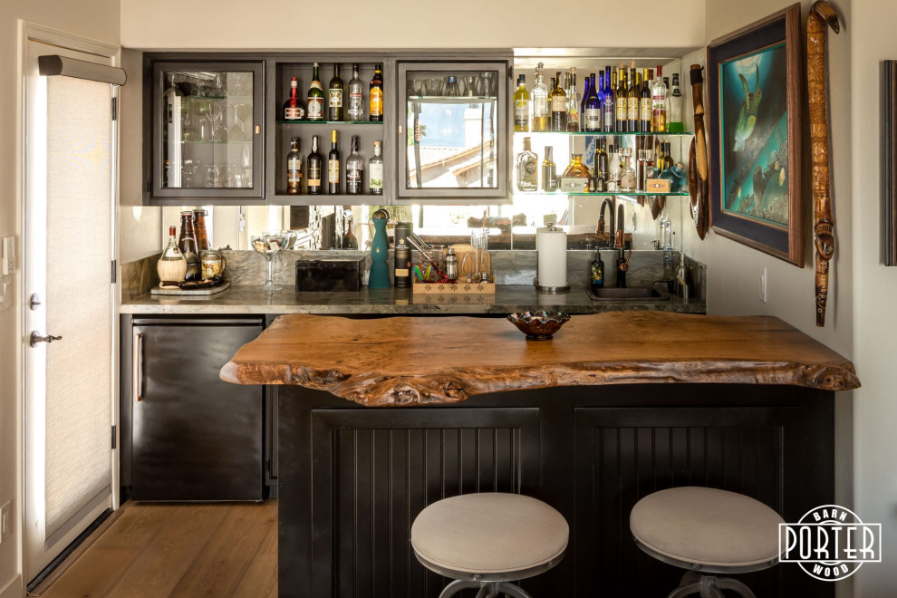 Design ideas for a tropical home bar in Phoenix.