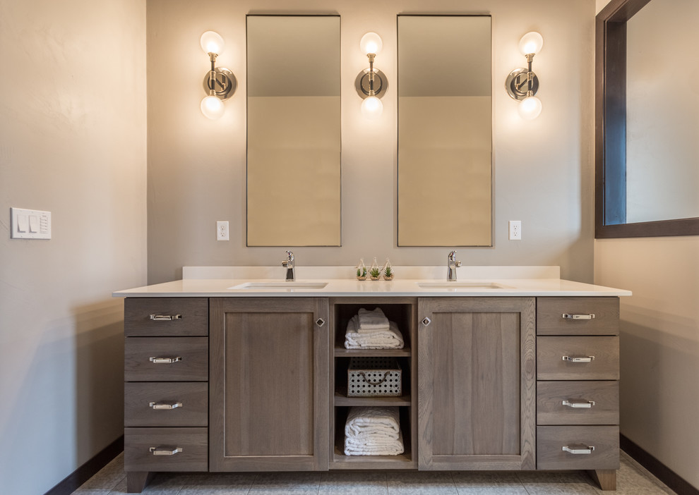 Country master bathroom with shaker cabinets, distressed cabinets, a freestanding tub, an alcove shower, beige walls, vinyl floors, an undermount sink, quartzite benchtops, grey floor and white benchtops.