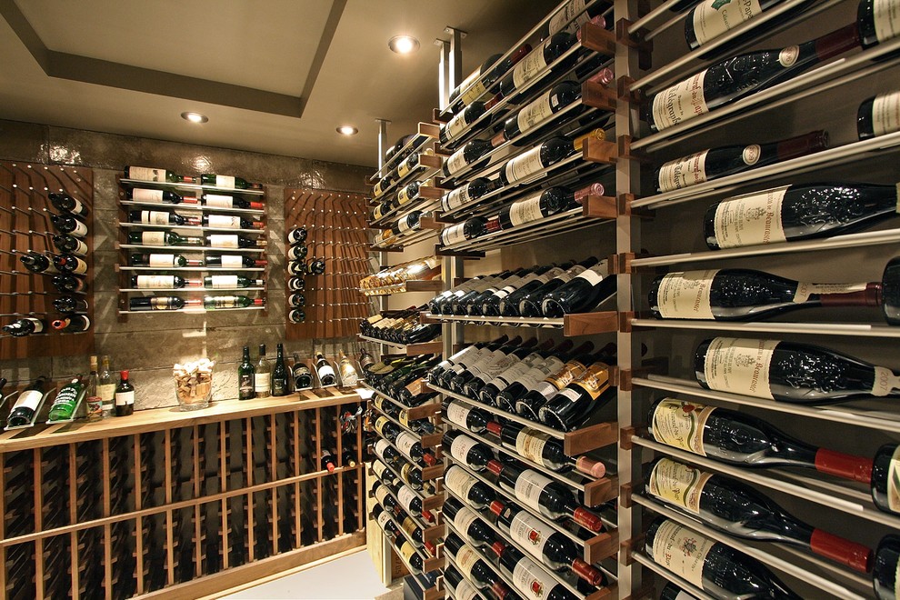 Design ideas for a mid-sized contemporary wine cellar in Phoenix with display racks, porcelain floors and grey floor.