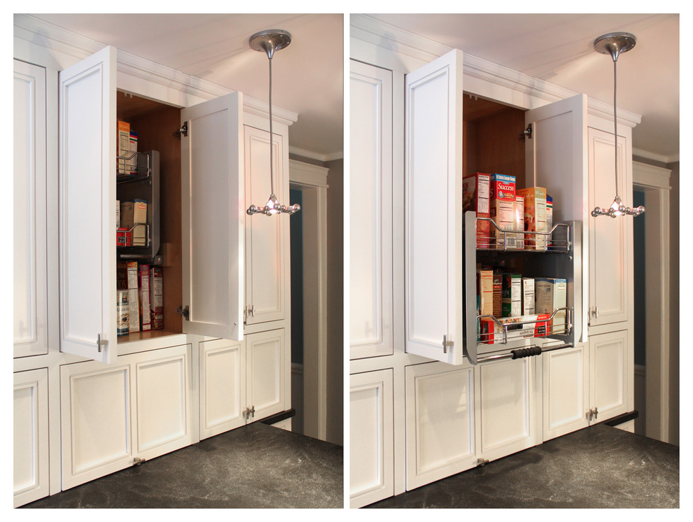 Inspiration for a mid-sized transitional l-shaped slate floor eat-in kitchen remodel in Boston with a farmhouse sink, raised-panel cabinets, white cabinets, granite countertops, metallic backsplash, metal backsplash, stainless steel appliances and an island