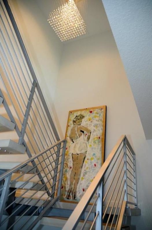 This is an example of an industrial wood staircase in Tampa with metal risers.