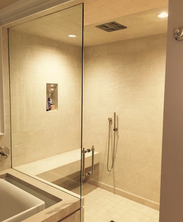 Inspiration for a large timeless master beige tile and porcelain tile porcelain tile and beige floor drop-in bathtub remodel in Orange County with beige walls and a hinged shower door
