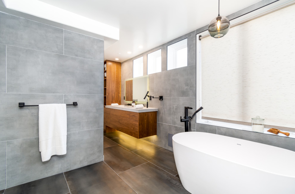 Example of a mid-sized minimalist master gray tile and porcelain tile gray floor and single-sink bathroom design in Los Angeles with flat-panel cabinets, dark wood cabinets, a bidet, gray walls, a drop-in sink, quartzite countertops, white countertops and a floating vanity