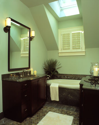 Inspiration for a large transitional multicolored floor, double-sink and vaulted ceiling alcove bathtub remodel in Charleston with dark wood cabinets, green walls, an undermount sink, granite countertops, black countertops and a built-in vanity
