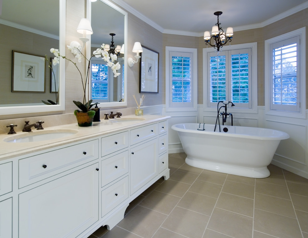 Large traditional master bathroom in Portland with shaker cabinets, white cabinets, a freestanding tub, beige walls, ceramic floors, an undermount sink, engineered quartz benchtops and beige floor.