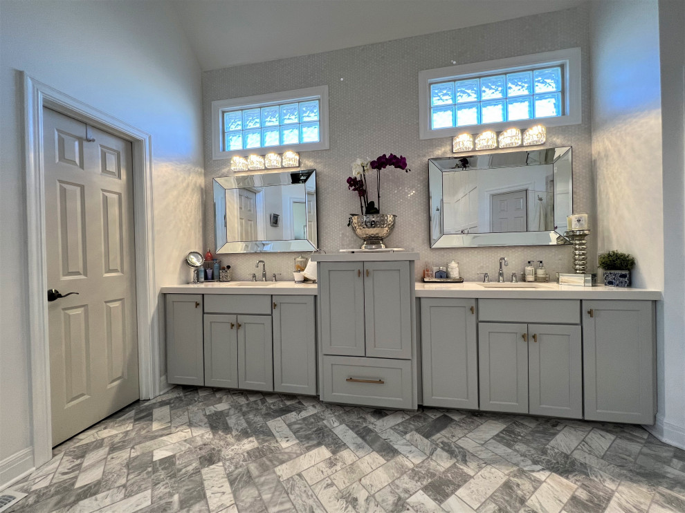 Inspiration for a large contemporary bathroom in Kansas City with grey cabinets, grey tiles, grey walls, marble flooring, marble worktops, multi-coloured floors, white worktops, double sinks and a built in vanity unit.