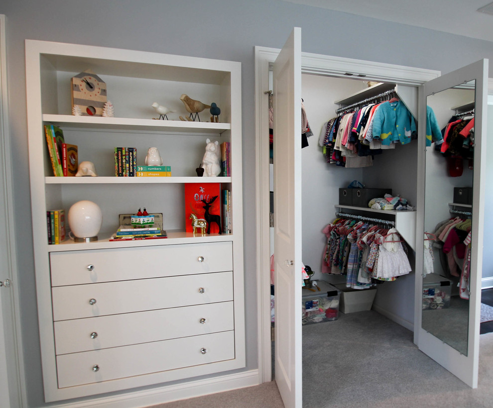Mid-sized arts and crafts gender-neutral walk-in wardrobe in Bridgeport with open cabinets, carpet and grey floor.