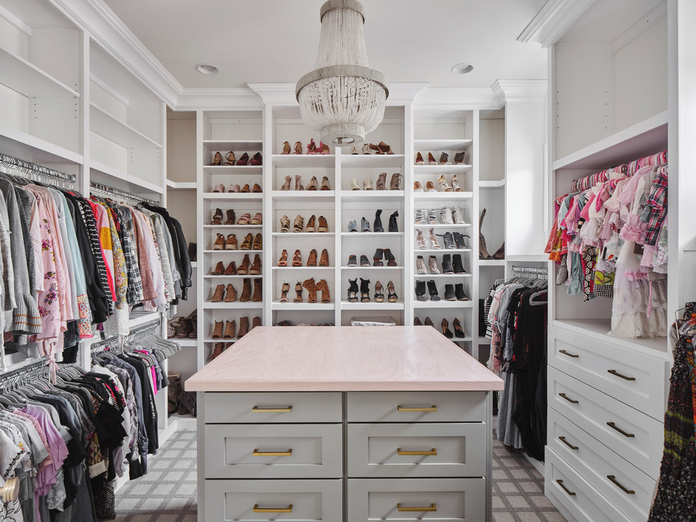 Inspiration for a large country women's walk-in wardrobe in Phoenix with white cabinets, carpet, grey floor and open cabinets.