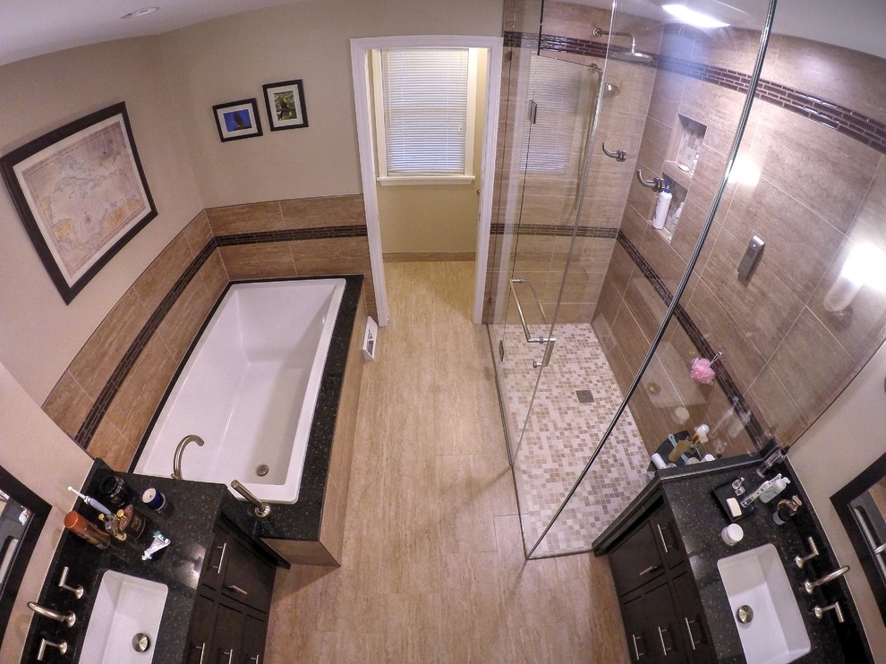 Large contemporary master bathroom in Other with an undermount sink, flat-panel cabinets, dark wood cabinets, engineered quartz benchtops, a drop-in tub, a curbless shower, a two-piece toilet, beige tile, porcelain tile, beige walls and porcelain floors.