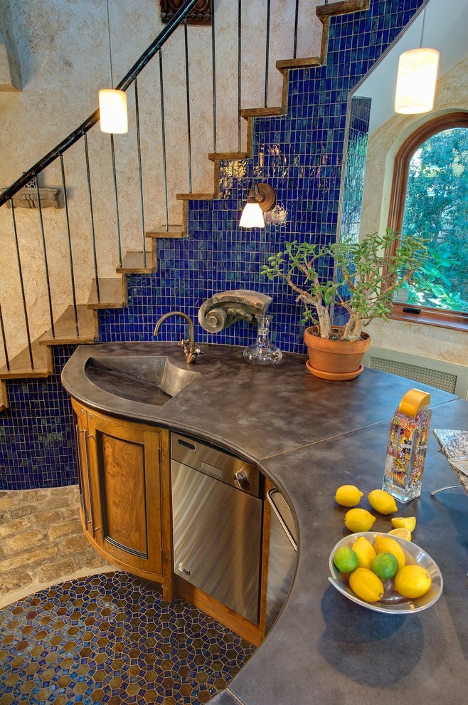 Photo of a large eclectic u-shaped seated home bar in Philadelphia with an integrated sink, recessed-panel cabinets, medium wood cabinets, concrete benchtops, blue splashback, ceramic splashback, ceramic floors and multi-coloured floor.