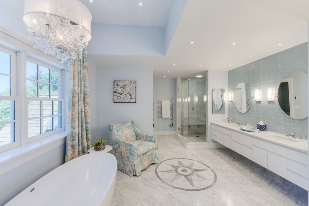 Freestanding bathtub - large transitional master blue tile and glass tile marble floor freestanding bathtub idea in Boston with flat-panel cabinets, white cabinets, an undermount sink, quartz countertops and white walls