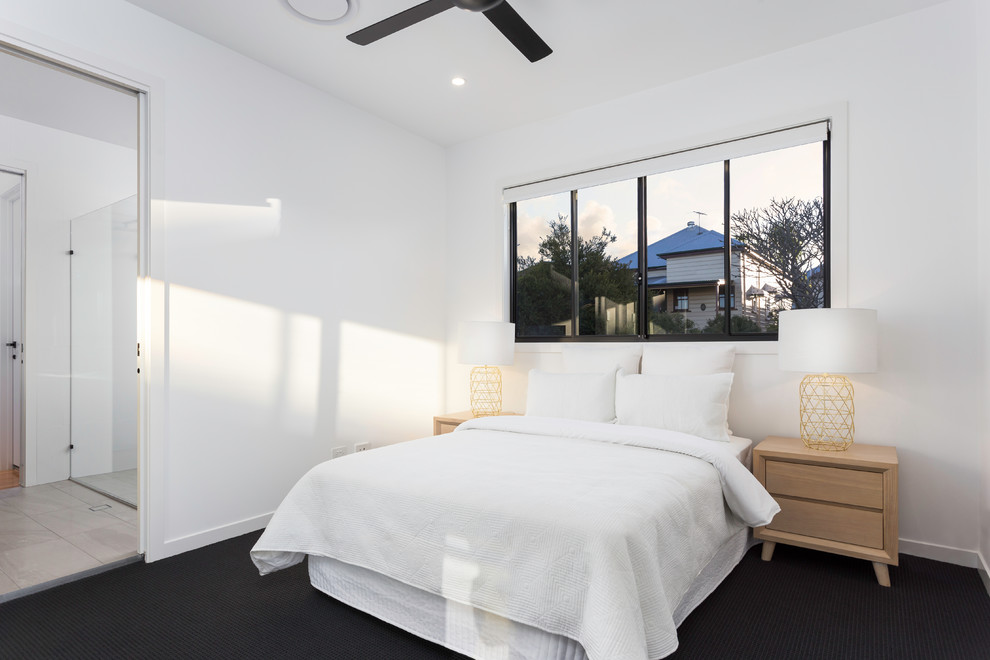 Contemporary bedroom in Brisbane with white walls, carpet and black floor.