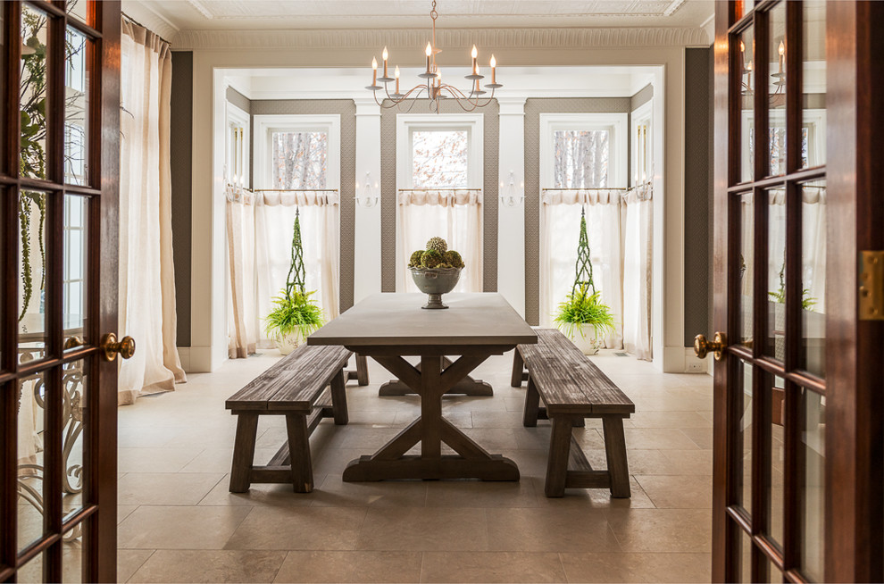 This is an example of a large traditional separate dining room in Chicago with limestone floors.