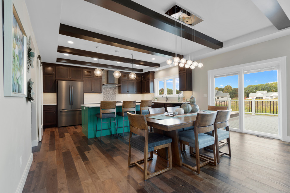 Mid-sized transitional l-shaped medium tone wood floor, brown floor and tray ceiling eat-in kitchen photo with an undermount sink, shaker cabinets, medium tone wood cabinets, quartz countertops, gray backsplash, glass tile backsplash, black appliances, an island and white countertops