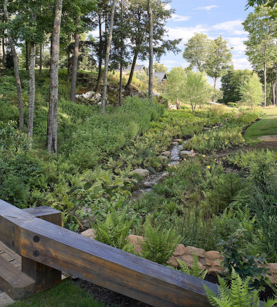 Photo of a contemporary backyard shaded garden in Burlington with a water feature.