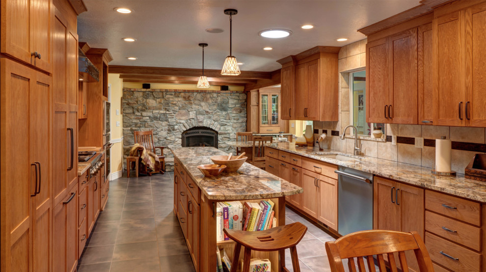 Enclosed kitchen - mid-sized transitional galley enclosed kitchen idea with recessed-panel cabinets, medium tone wood cabinets, stainless steel appliances, an island, an undermount sink, beige backsplash and cement tile backsplash