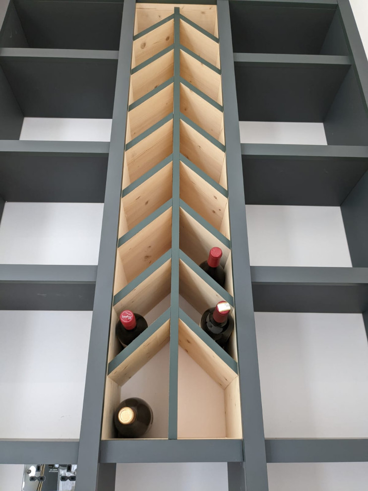 Example of a trendy wine cellar design in Surrey