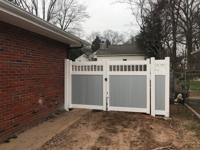 Fence installation after patio and retaining wall