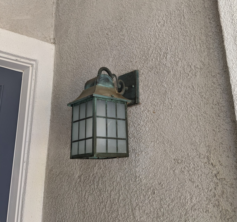 Installing an exterior security camera "near" a light fixture (stucco)