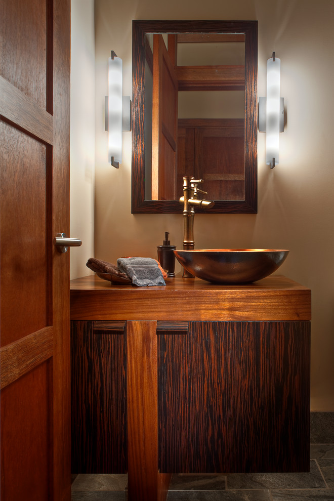 Contemporary powder room in Seattle with a vessel sink, flat-panel cabinets, dark wood cabinets, wood benchtops and brown benchtops.