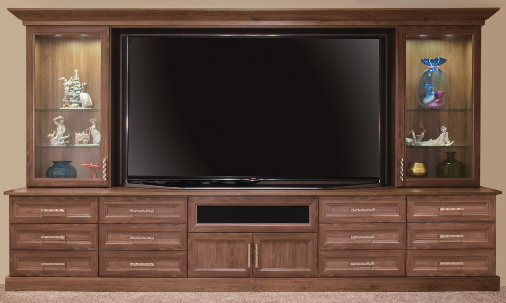Inspiration for a large traditional enclosed home theatre in Chicago with beige walls, carpet and a wall-mounted tv.