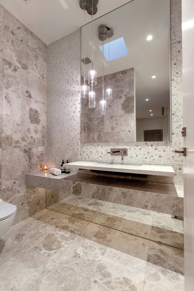 Design ideas for a mid-sized contemporary bathroom in Melbourne with a wall-mount sink, a wall-mount toilet, gray tile and mosaic tile.