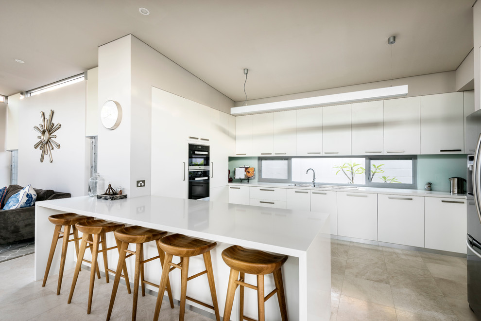 Inspiration for a large contemporary kitchen in Perth with a double-bowl sink, white cabinets, quartz benchtops, grey splashback, glass sheet splashback, stainless steel appliances and with island.