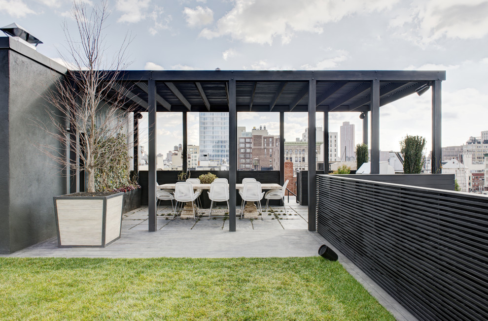 This is an example of a contemporary rooftop and rooftop deck in New York.