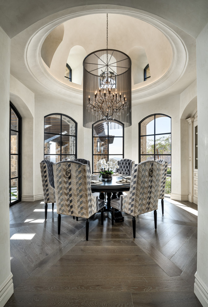 This is an example of a large dining room in Phoenix with medium hardwood floors and vaulted.
