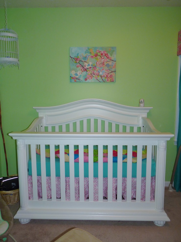 Small contemporary nursery in Raleigh with green walls for girls.