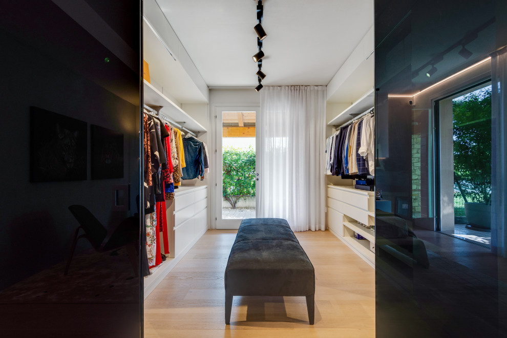 Large contemporary storage and wardrobe in Venice with painted wood floors and recessed.