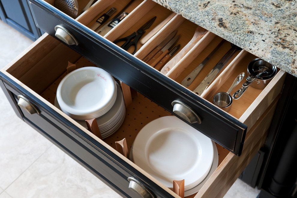 Inspiration for a large ceramic tile kitchen remodel with raised-panel cabinets, black cabinets, quartzite countertops, stainless steel appliances and an island