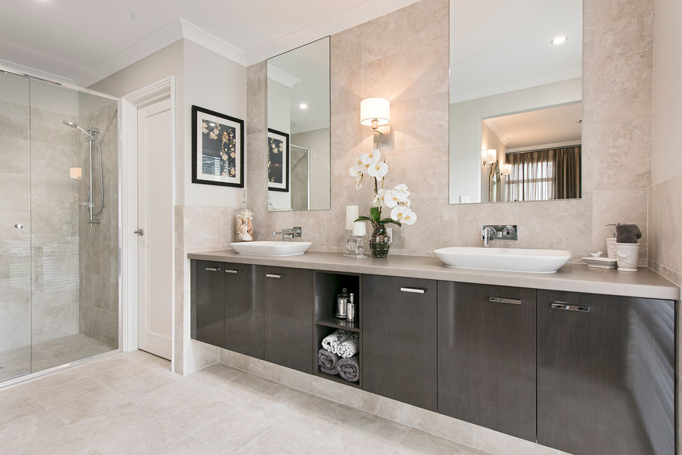 Design ideas for a large modern master bathroom in Perth with an integrated sink, flat-panel cabinets, medium wood cabinets, laminate benchtops, a double shower, a one-piece toilet, beige tile, ceramic tile, grey walls and ceramic floors.