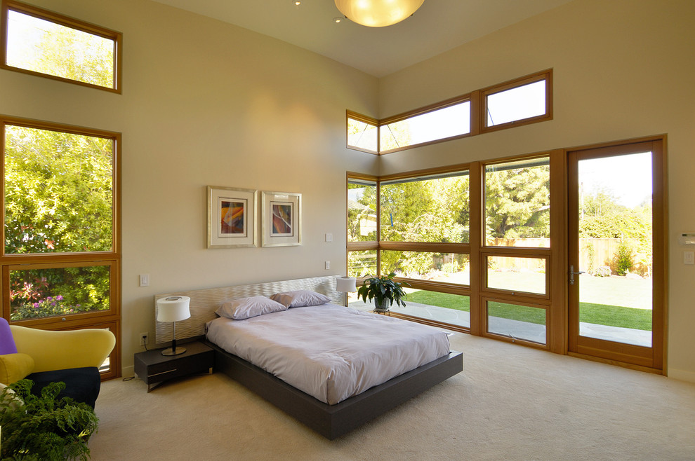 Design ideas for a mid-sized contemporary bedroom in San Francisco with beige walls, carpet and beige floor.