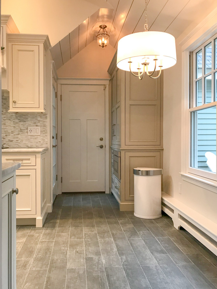 Small transitional u-shaped vaulted ceiling eat-in kitchen photo with beaded inset cabinets, white cabinets, paneled appliances and no island