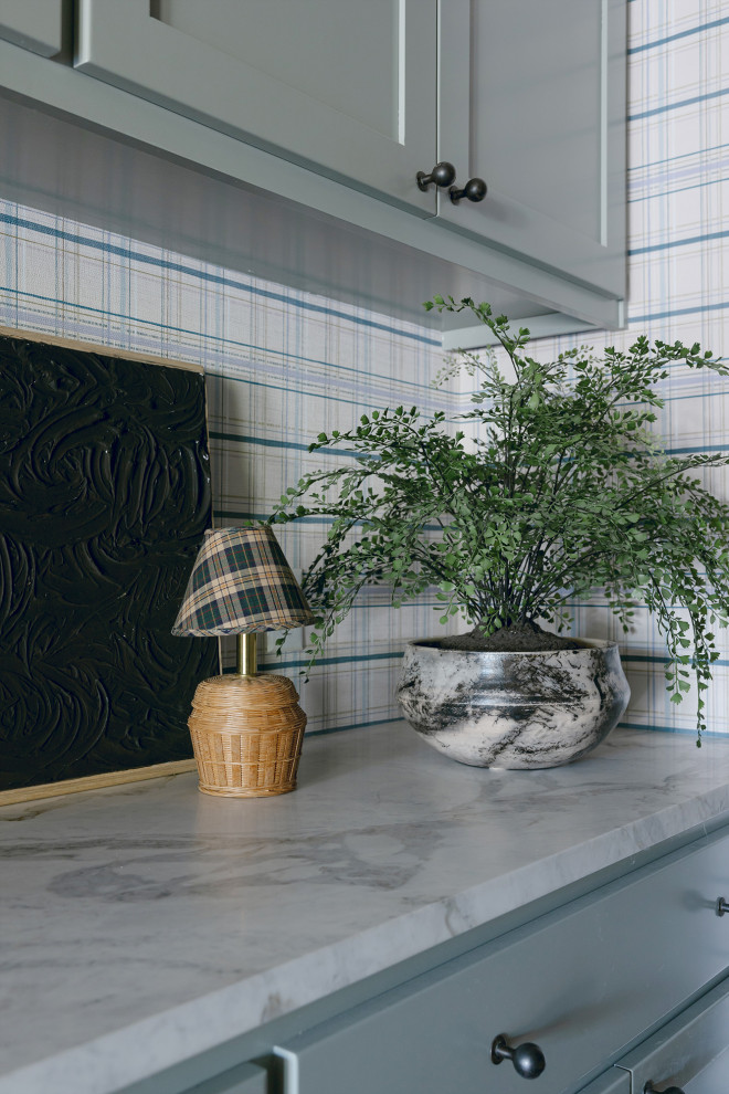Fresh Vintage-Inspired Wallpapers in an Austin Home - This laundry room features Chasing Paper's "Vintage Plaid" wallpaper on the walls.
