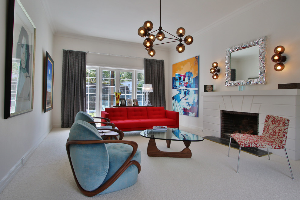 Inspiration for a mid-sized eclectic enclosed living room in Melbourne with white walls, carpet, a standard fireplace, a concrete fireplace surround and white floor.