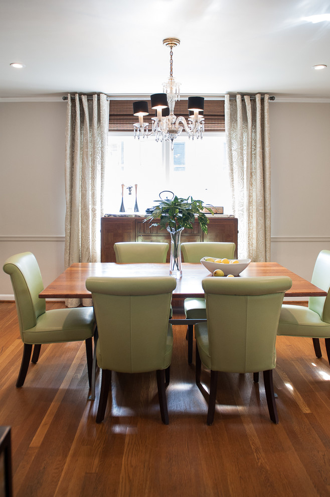 Mid-sized transitional medium tone wood floor enclosed dining room photo in Atlanta with beige walls and no fireplace