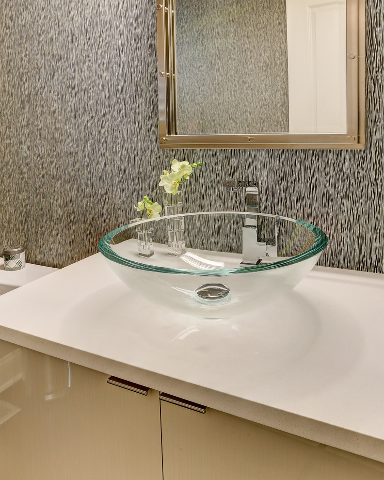 Photo of a large contemporary powder room in Other with flat-panel cabinets, white cabinets, a two-piece toilet, white tile, porcelain tile, grey walls, porcelain floors, a vessel sink, solid surface benchtops and white benchtops.